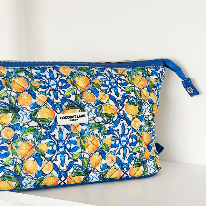 Amalfi Lemon expandable makeup bag by Cocopup London with a lemon print design and blue zipper.