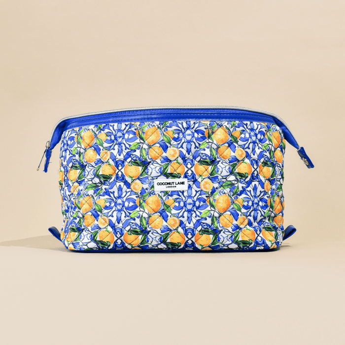 Expandable makeup bag in blue with white and orange lemon leaf print by Cocopup London.