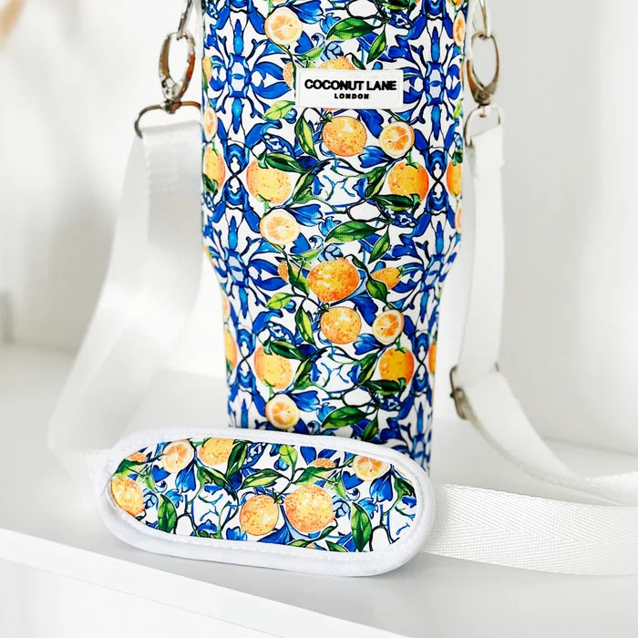 Lemon-patterned tumbler carry case with green leaves, white strap, and Cocopup London label on the front.