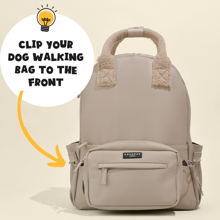 Caramel-colored Cocopup London rucksack with soft, fluffy handles and front text: “Clip your dog walking bag to the front.”.