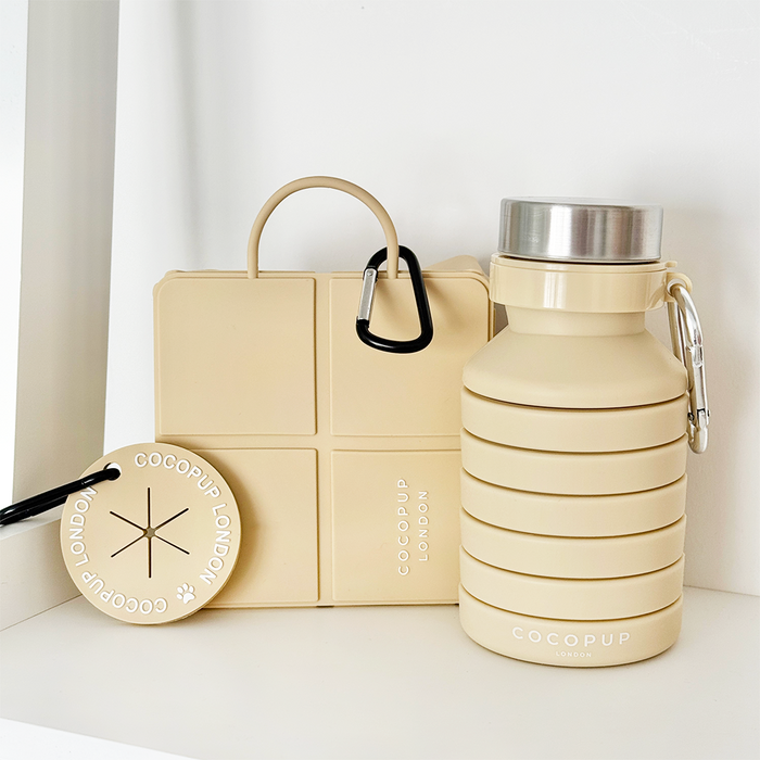 Nude Cocopup London bag accessory bundle arranged neatly on a white shelf.