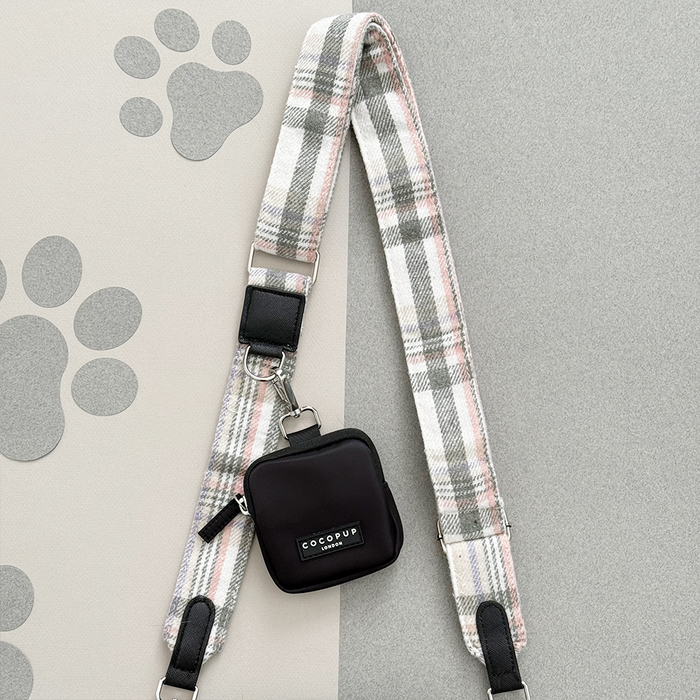 Oxford plaid Cocopup London bag strap with black pouch on a grey surface with white paw prints.