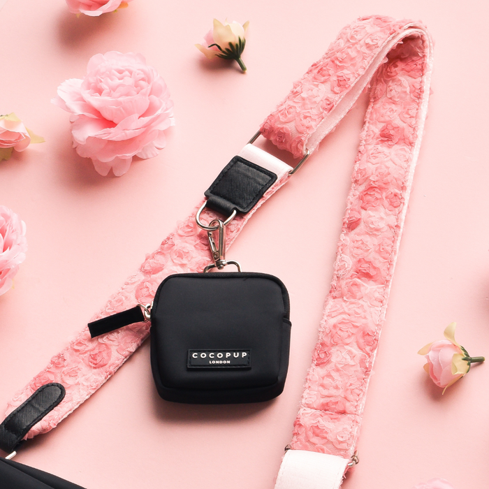 Pink Cocopup London bag strap with Peony Pup floral pattern.
