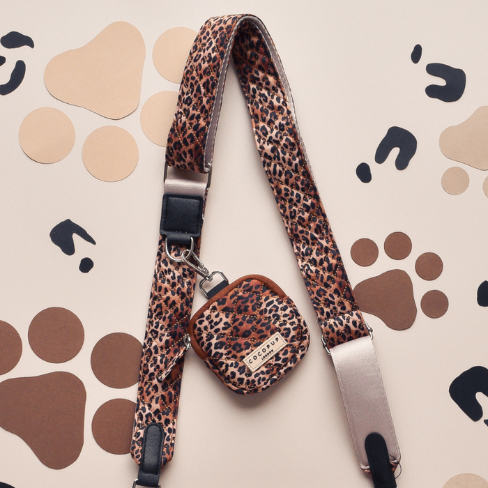 Cocopup London beige quilted bag strap with brown and black leopard paw pattern.