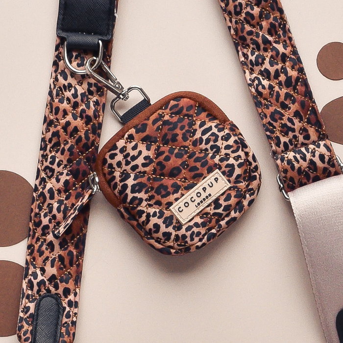Beige quilted bag strap with brown leopard spots and a matching pouch.