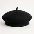 Black wool beret dog hat with center stem, displayed on a white background.
