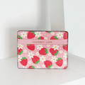 Pink Cocopup London card holder with strawberry and daisy prints on a white surface.