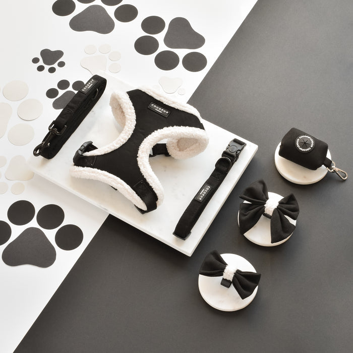 Black Aviator Bow Tie by Cocopup London displayed on a paw-print patterned background.