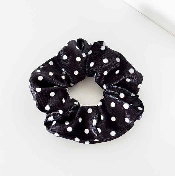 Black scrunchie with white polka dots.