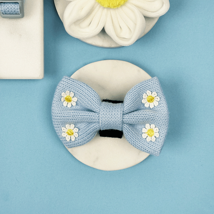 Blue dog Bow Tie with white flower decals.