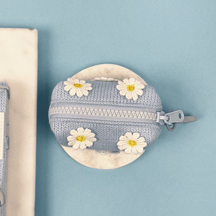 Blue dog Poop Bag Holder with white flower decals.
