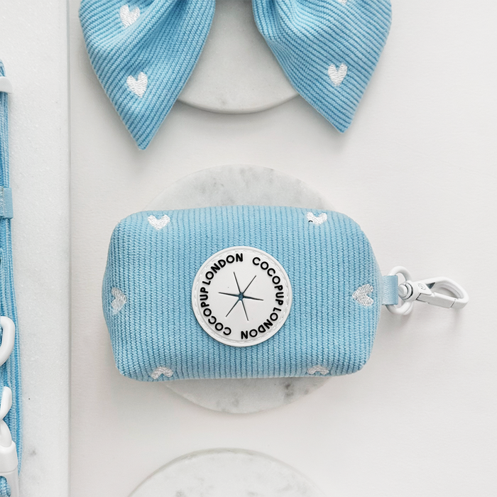Light blue cord poop bag holder with white heart pattern from Cocopup London.