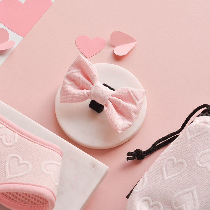 Baby pink bow tie with heart pattern, designed for dogs or drawstring bags, from Cocopup London Luxe collection.