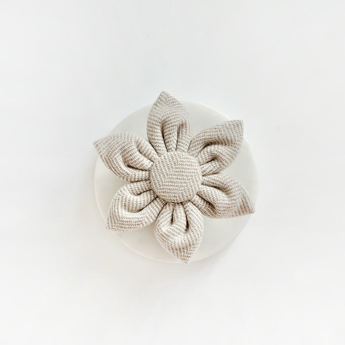 Brown tweed collar flower by Cocopup London displayed on a round white surface with a plain white background.