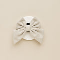 Brown tweed sailor bow tie by Cocopup London displayed on a white card with a simple neutral background.