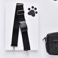 Wide black Cocopup London strap with metal clips beside a mocha bum bag bundle.