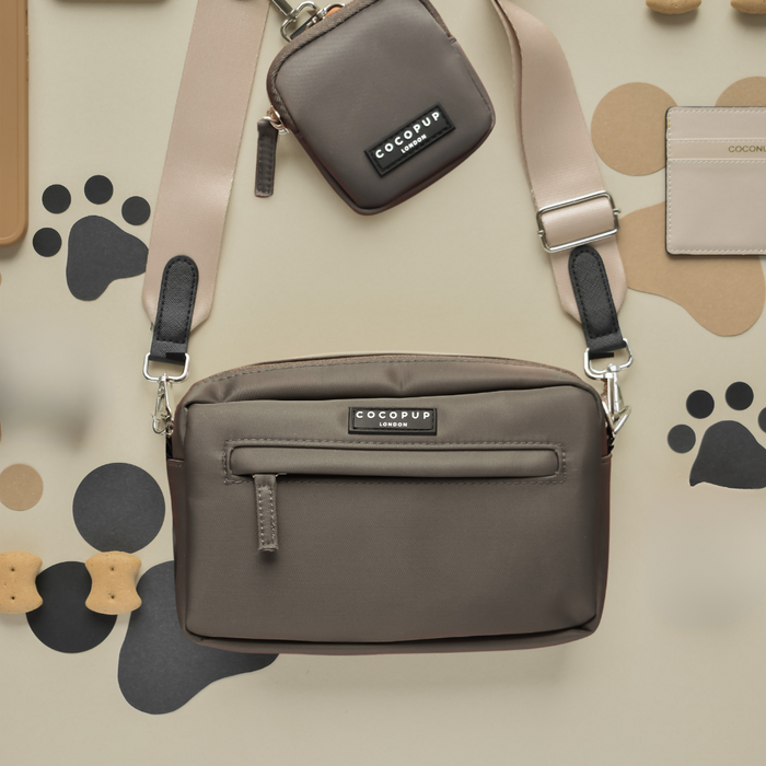 Mocha dog walking bag with treat pouch, poop bag dispenser, and beige paw print pattern.