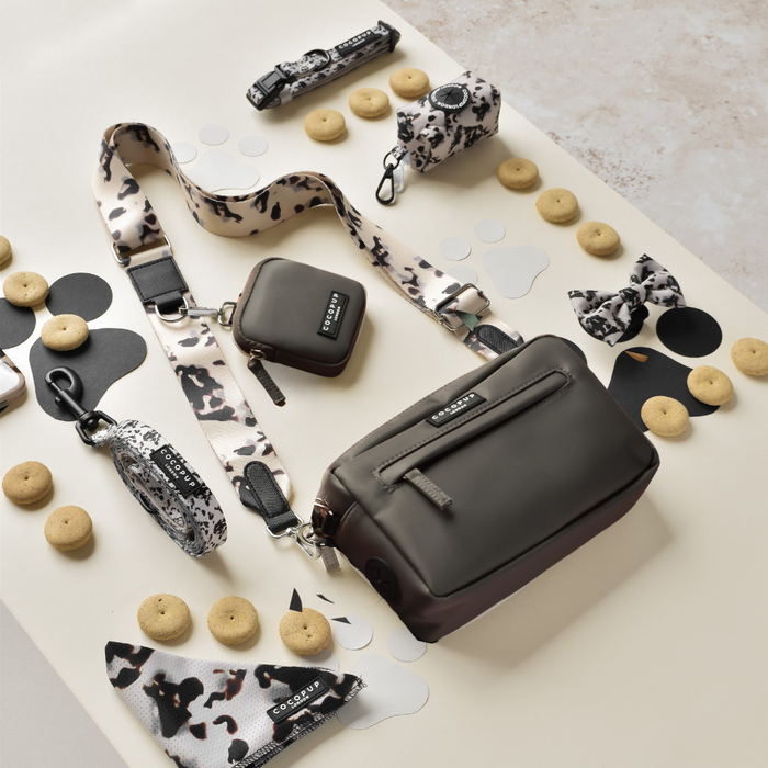Mocha Cocopup London dog walking bag with matching treat pouch and poop bag dispenser, all in coordinated colors.