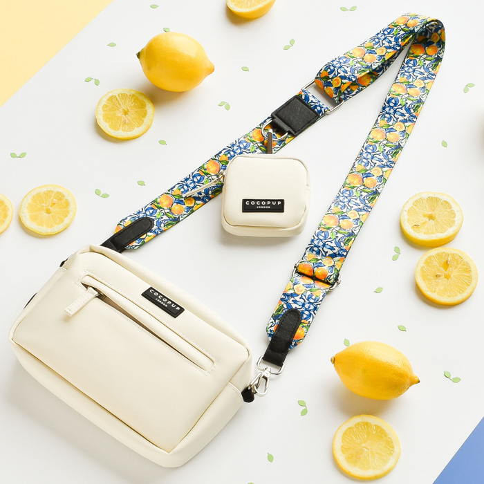 Oyster white dog walking bag with lemon yellow strap and attached small treat pouch by Cocopup London.