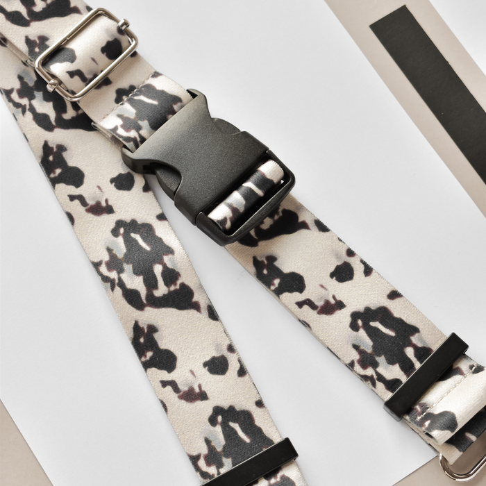Black and white camo dog collar with metal buckle, featuring a sleek, modern pattern on durable fabric.