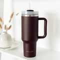 Burgundy stainless steel tumbler with handle and straw, featuring Cocopup London branding.