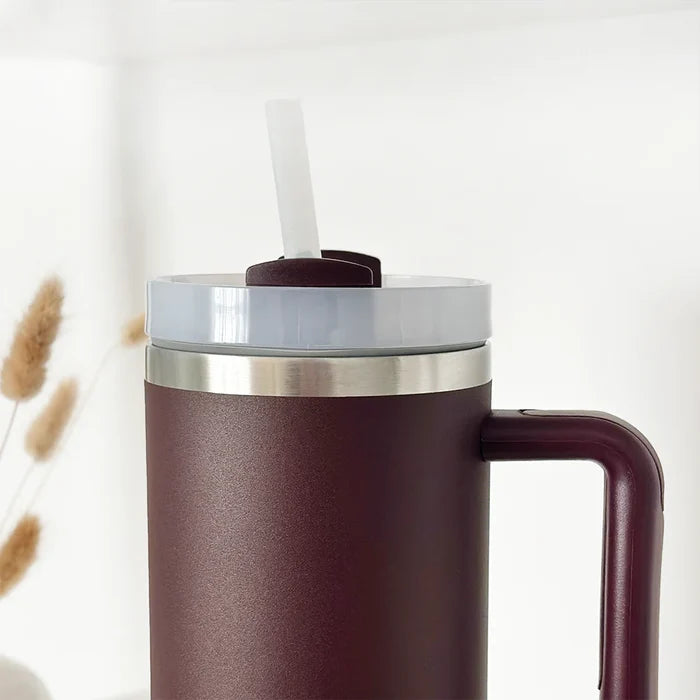 Burgundy stainless steel tumbler with Cocopup London branding, smooth matte finish.