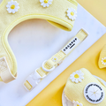 Yellow Cocopup London Buttercup Pup collar with white daisy pattern on a yellow and white background.