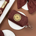 Brown cable knit poop bag holder with gold zipper and clip, designed by Cocopup London.