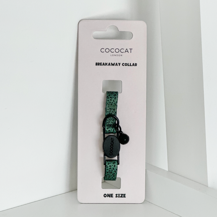 Khaki leopard-print cat collar by Cocopup London with black bell, breakaway buckle, and Breakaway Collar label.