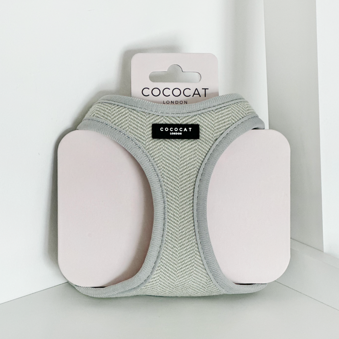 Sage tweed Cocopup London cat harness on pale pink packaging, white background.