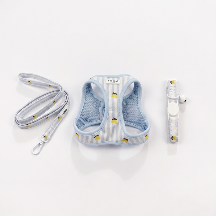 Cat harness, lead, and collar set with small yellow lemons on light blue striped fabric.