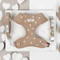 Cocopup London Chai Hearts harness, lead and collar set in beige with white heart pattern, displayed on a white surface.