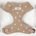 Beige ribbed dog harness with white hearts and a center Cocopup London label.