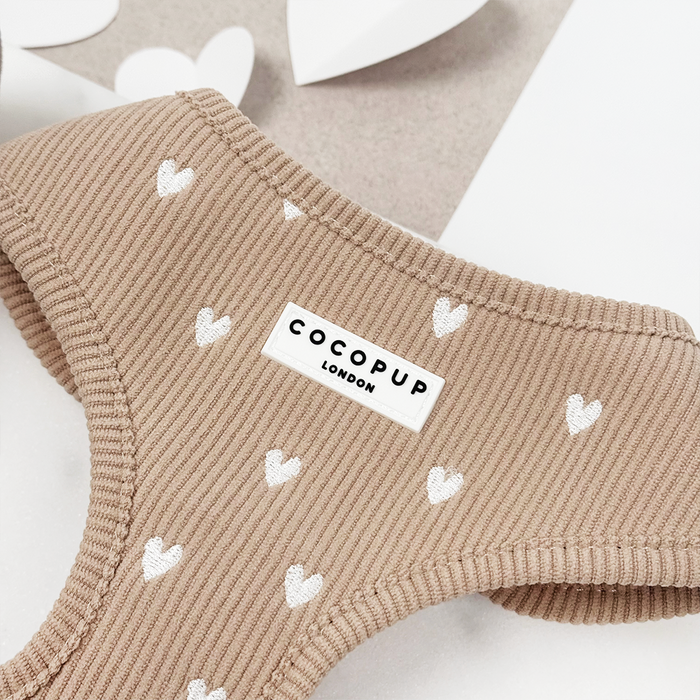 Tan adjustable neck harness with white heart pattern by Cocopup London.