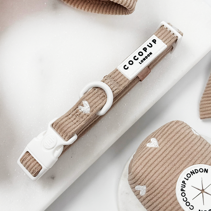 Beige dog collar with white heart pattern, adjustable design from Cocopup London.