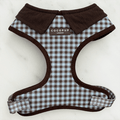 A brown and blue check print dog harness. With brown hardware and brown corduroy collar detail.