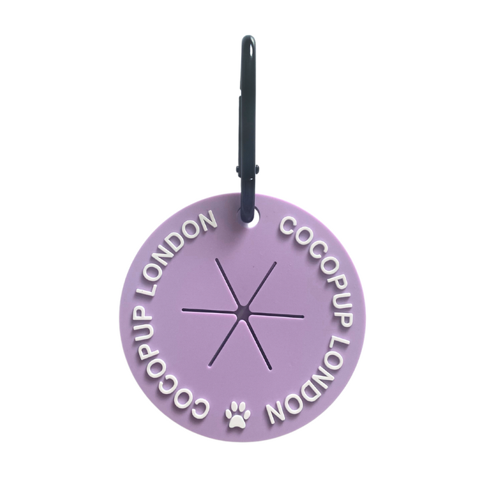 Light purple circular poop bag holder with zip and metal clip, branded as CocoPOOP Pocket - Parma Violets by Cocopup London.