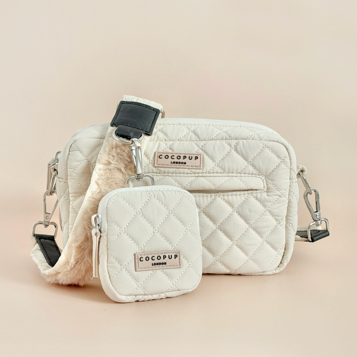 Cream quilted dog walking bag set with matching treat pouch, silver clasps, and faux fur accent.