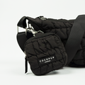 Black quilted treat pouch with a crescent shape, designed for dog walking.