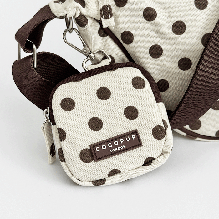 Polka dot pouch with COCOPUP LONDON branding on a white background