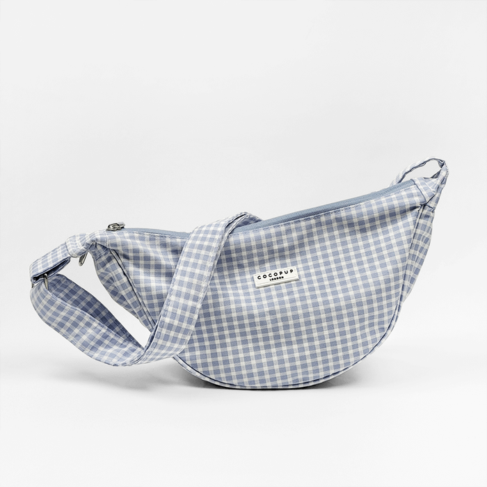 Blue and white gingham check print bag with matching strap.