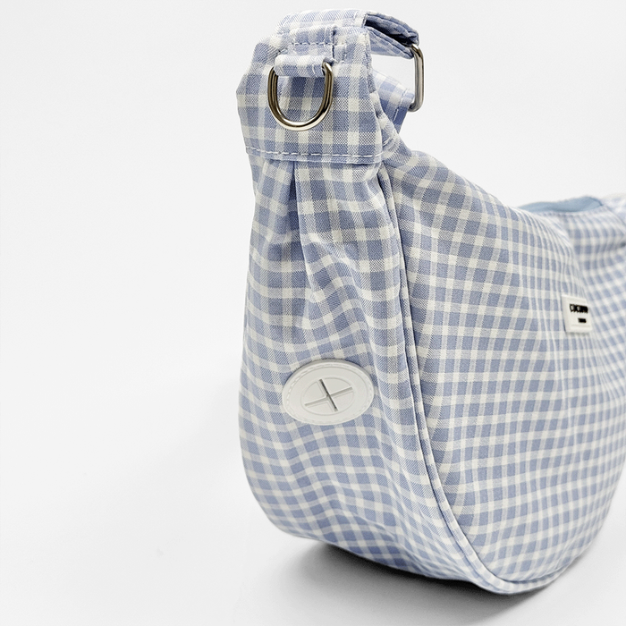 Blue and white gingham check print bag showing the built-in poop bag dispenser.