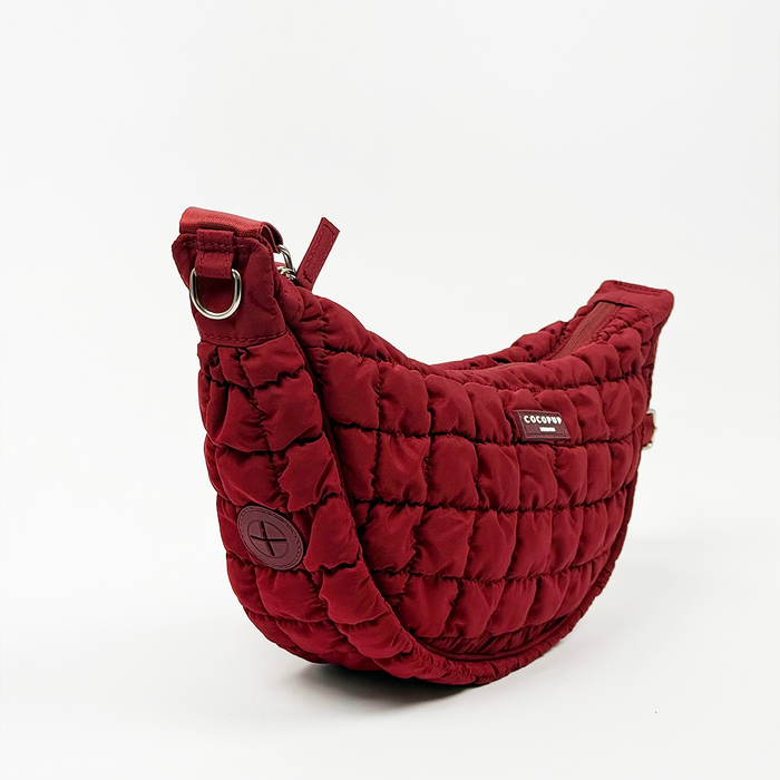 Quilted red crossbody dog walking bag with a short strap, Cocopup London Crescent style in Merlot.