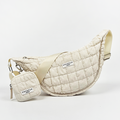 Light grey Cocopup London crescent crossbody dog walking bag with matching pouch attached.