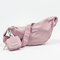 Pink and white gingham check design bag with matching strap and treat pouch for dog treats.