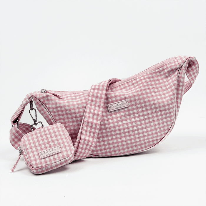 Pink and white gingham check design bag with matching strap and treat pouch for dog treats.