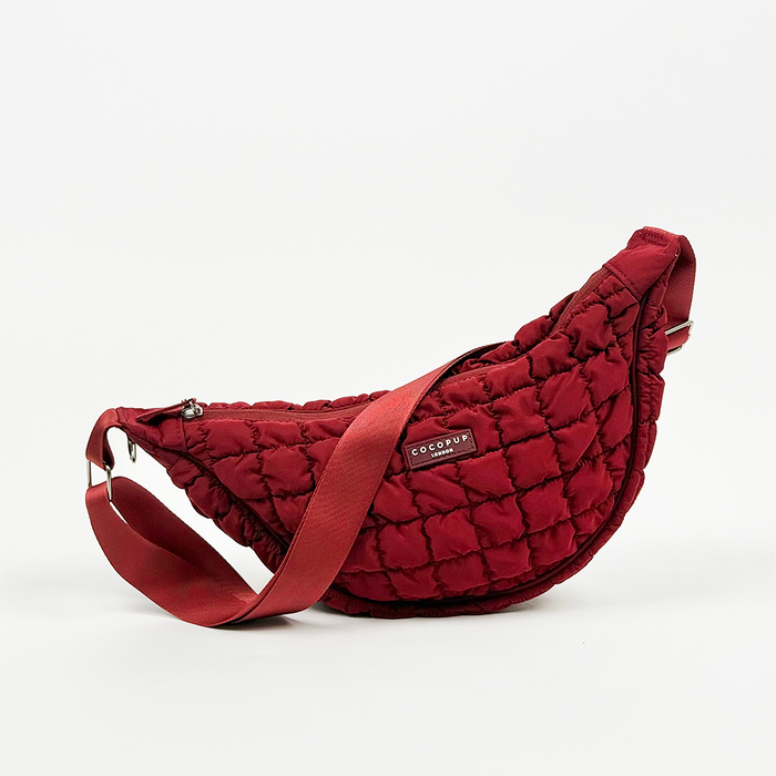 Merlot Cocopup London crossbody crescent dog walking bag with adjustable strap and front logo label.