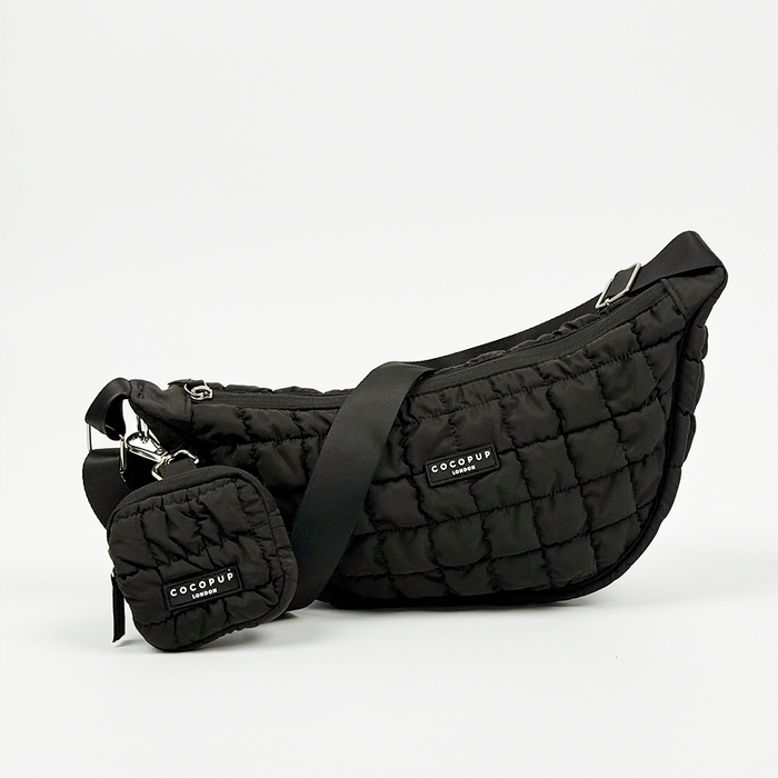 Black Cocopup London crescent crossbody dog walking bag with matching pouch.