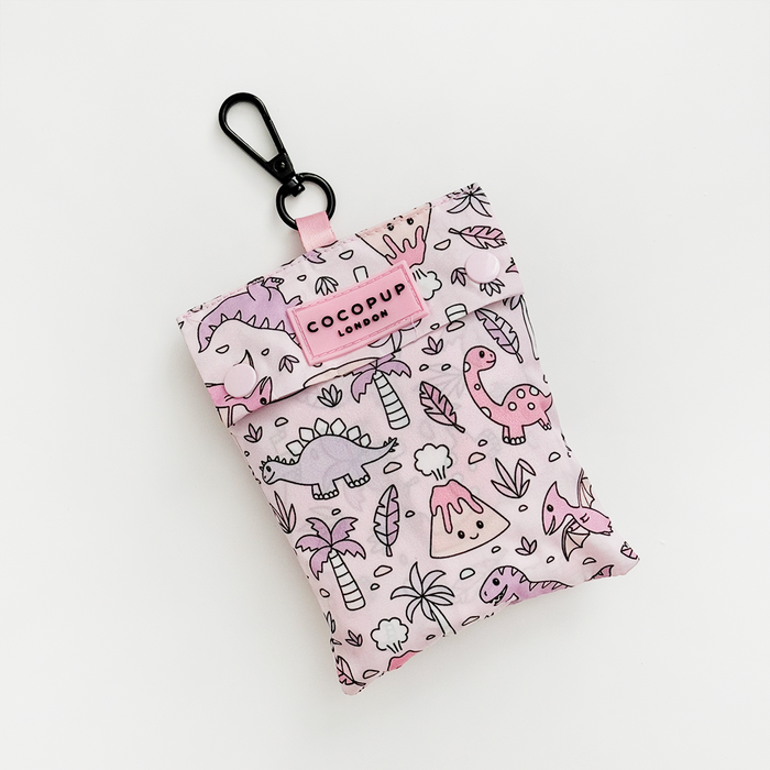 Pink pouch with black clip and cute dinosaur pattern.