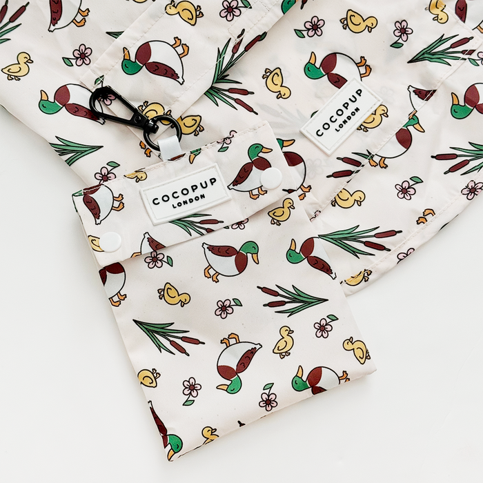 Beige fabric pouches featuring duck and flower patterns.